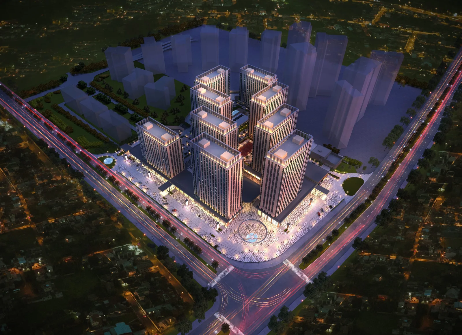 Aerial night view of an urban masterplan with high-rise towers around a central plaza